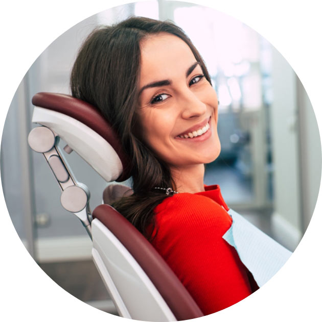 A Beautiful Women Sitting On Dental Chair