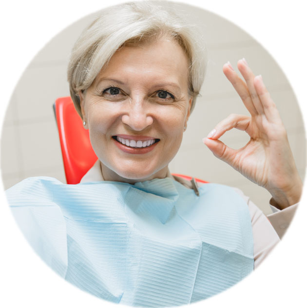 A Beautiful Women Sitting On Dental Chair