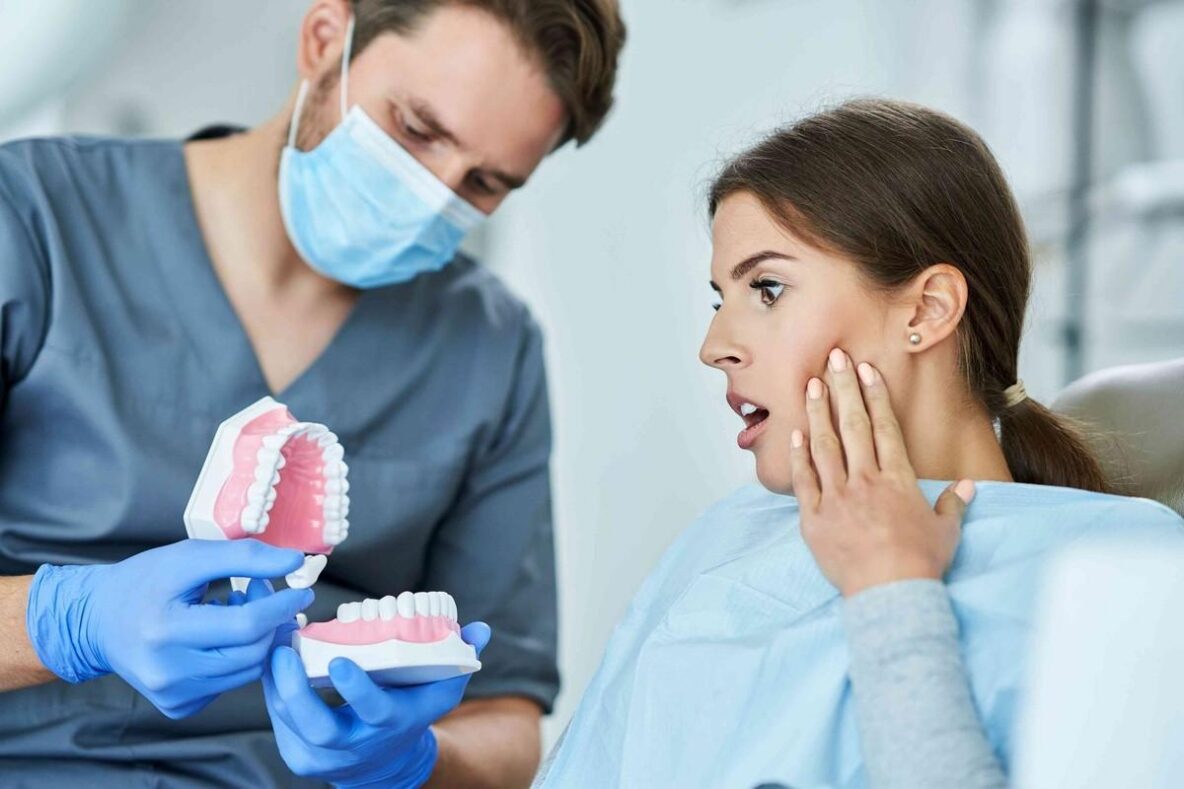 Patient discussing dental implant treatment during a dental visit
